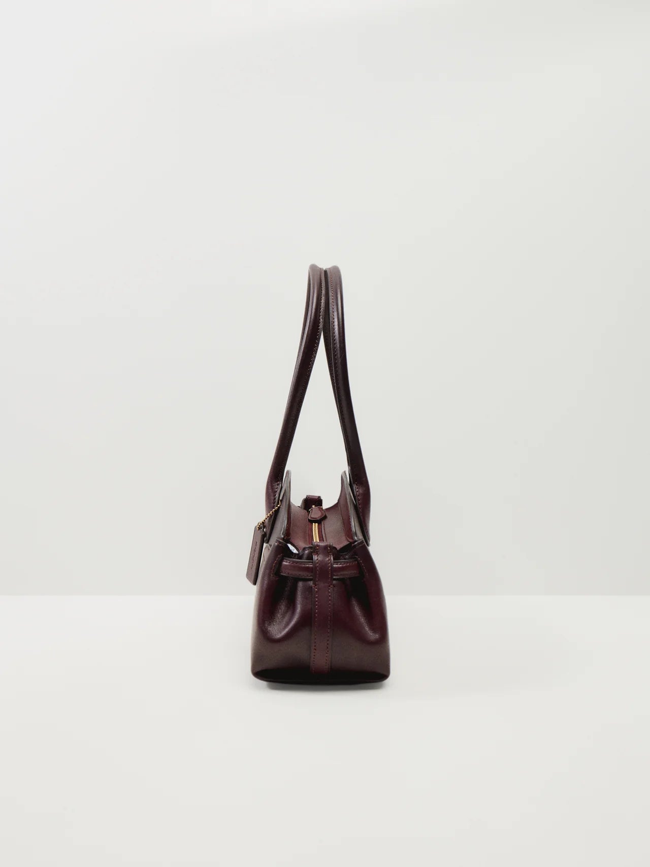 COACH  
Empire Carry All 34 Bag burgandy