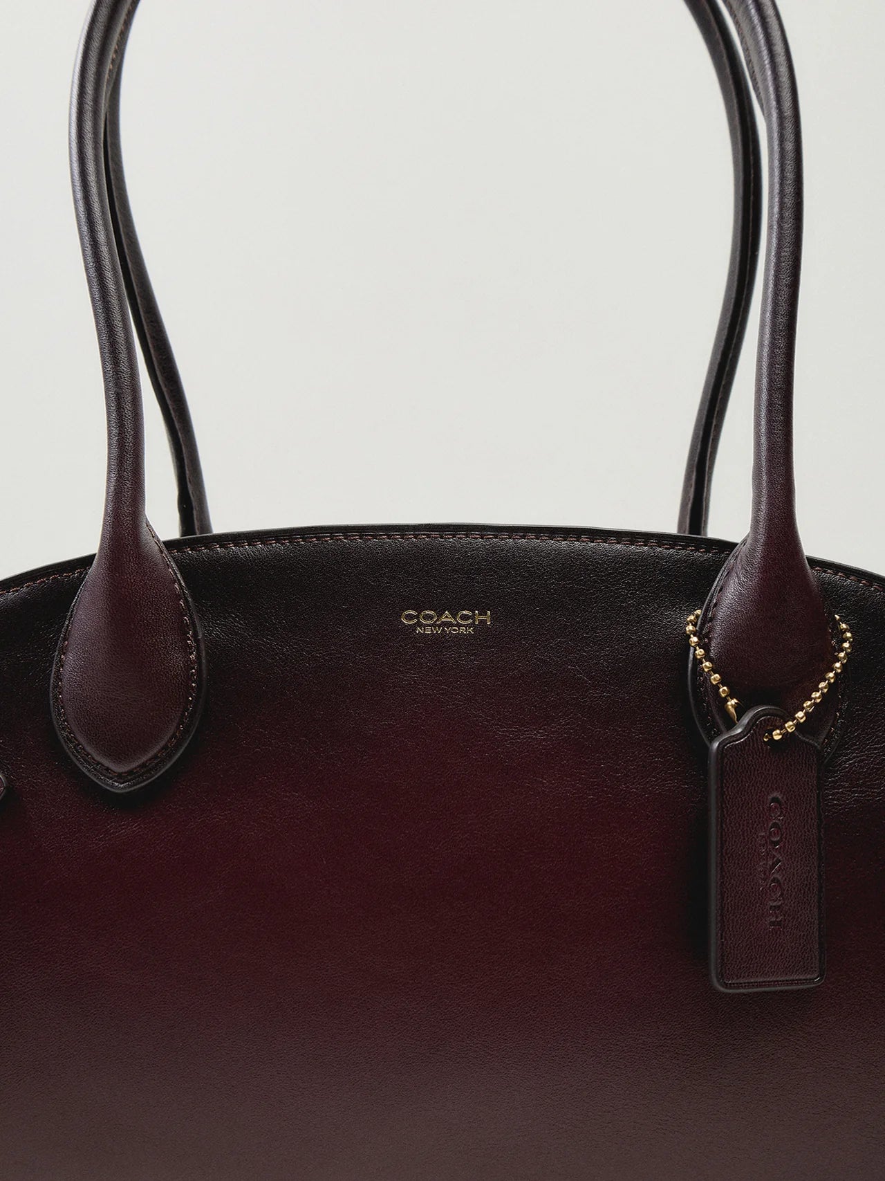COACH  
Empire Carry All 34 Bag burgandy